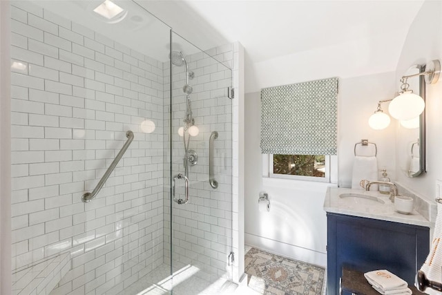 bathroom featuring vanity, a bath, and a shower stall