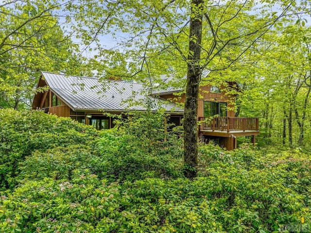 back of house featuring a deck