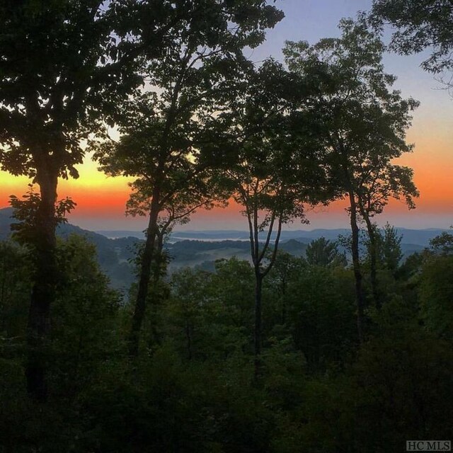 nature at dusk featuring a mountain view