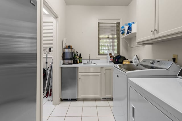 592 Whiteside Mountain Rd, Highlands, NC 28741 - laundry area featuring washing machine and dryer, cabinet space, and light tile patterned floors