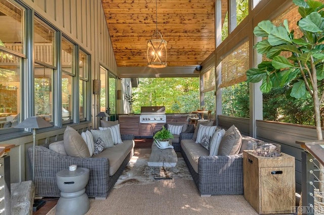 sunroom / solarium with a healthy amount of sunlight, vaulted ceiling, and wooden ceiling