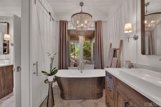 bathroom featuring vanity, a bath, wood ceiling, and a chandelier