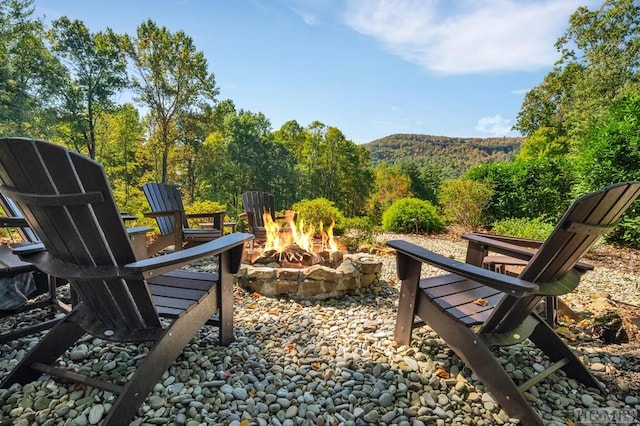 view of home's community with a fire pit