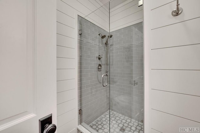 bathroom with a shower with shower door