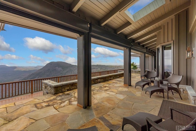 view of patio / terrace with a mountain view