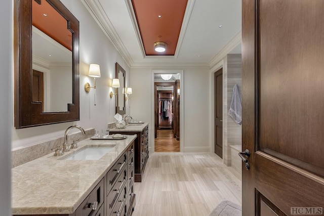 bathroom with vanity and crown molding