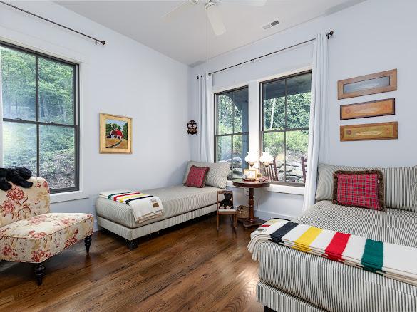 11 Feldspar Ln, Sapphire, NC 28774 - bedroom with multiple windows, wood finished floors, and a ceiling fan