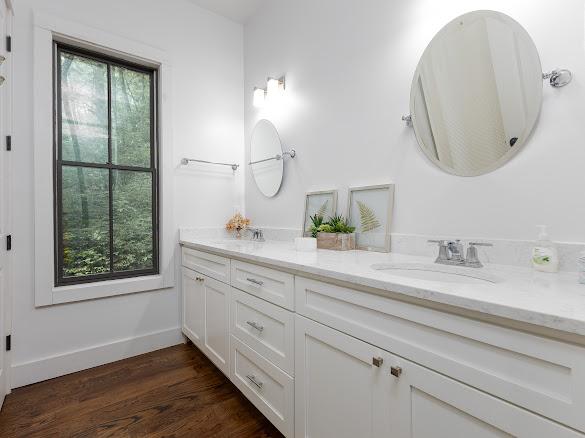 11 Feldspar Ln, Sapphire, NC 28774 - full bathroom featuring double vanity and wood finished floors