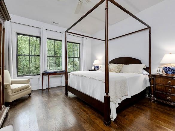 11 Feldspar Ln, Sapphire, NC 28774 - bedroom featuring wood finished floors and a ceiling fan
