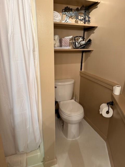 26 S Cumberland Dr, Lake Toxaway, NC 28747 - bathroom featuring toilet, a shower with shower curtain, and baseboards