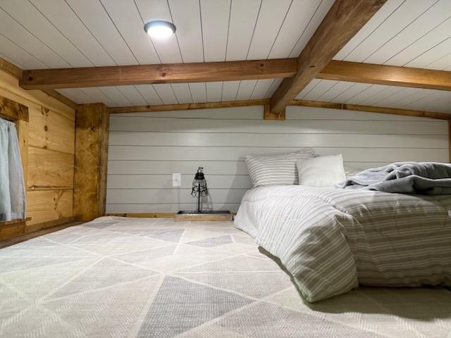 26 S Cumberland Dr, Lake Toxaway, NC 28747 - carpeted bedroom with wood walls and wooden ceiling with exposed beams