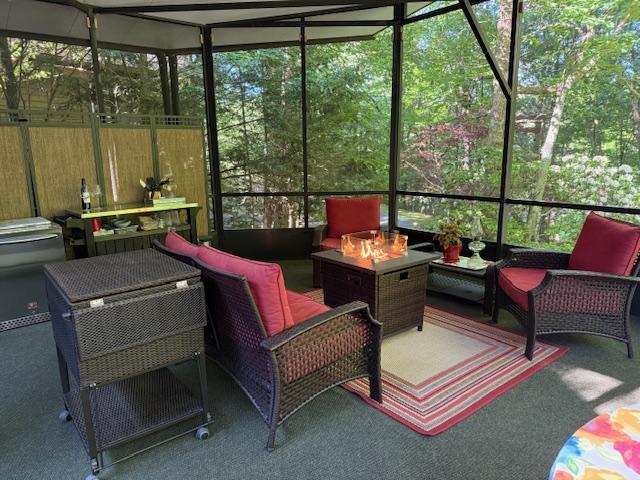 26 S Cumberland Dr, Lake Toxaway, NC 28747 - sunroom with an outdoor living space with a fire pit