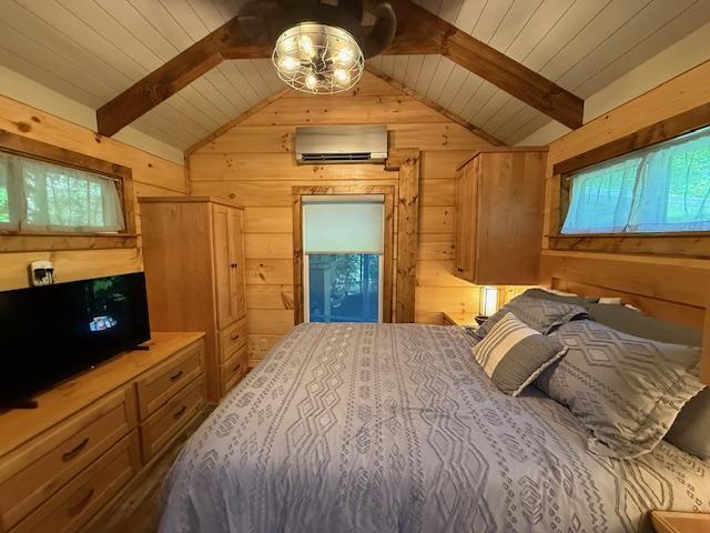 26 S Cumberland Dr, Lake Toxaway, NC 28747 - bedroom featuring an AC wall unit, wood walls, and wood ceiling