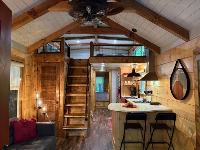 26 S Cumberland Dr, Lake Toxaway, NC 28747 - dining space featuring wooden walls, a ceiling fan, wood ceiling, and wood finished floors