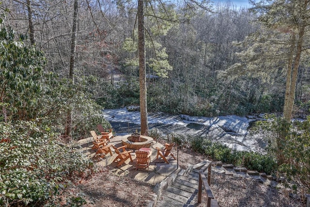 view of yard with an outdoor fire pit and a patio area