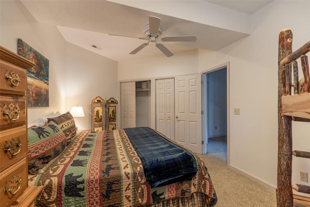 97 Twin Kettle Fls, Glenville, NC 28736 - bedroom featuring baseboards, visible vents, light colored carpet, a ceiling fan, and two closets