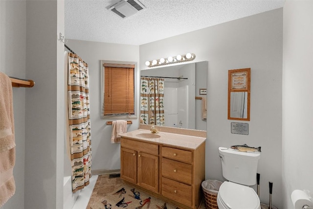 full bathroom with tile patterned flooring, vanity, toilet, a textured ceiling, and shower / bath combo with shower curtain