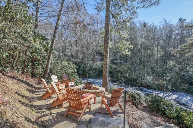 view of patio / terrace featuring an outdoor fire pit