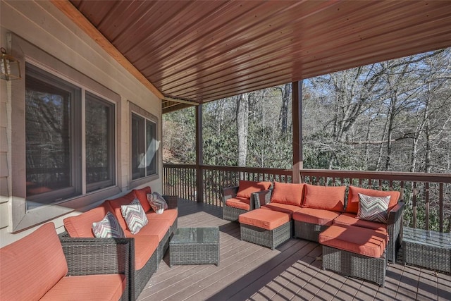 wooden terrace featuring an outdoor hangout area