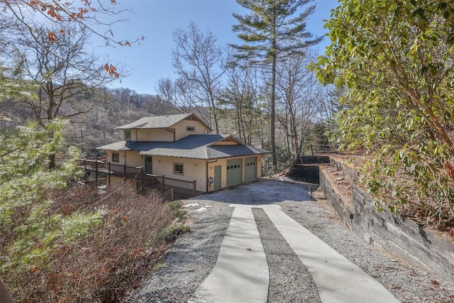 view of side of property with a garage