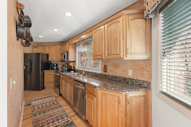 97 Twin Kettle Fls, Glenville, NC 28736 - kitchen featuring light brown cabinets, a sink, light wood-style flooring, a textured ceiling, and appliances with stainless steel finishes