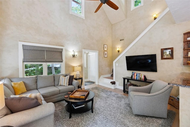 132 Azalea Ct, Sapphire, NC 28774 - living area featuring a ceiling fan, healthy amount of natural light, high vaulted ceiling, and wood finished floors