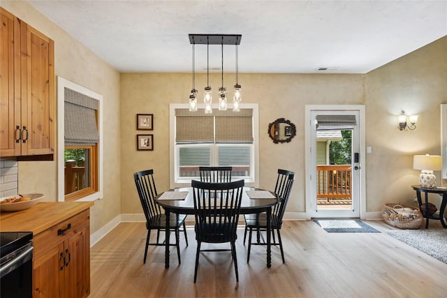 132 Azalea Ct, Sapphire, NC 28774 - dining space with light wood-style floors and a chandelier