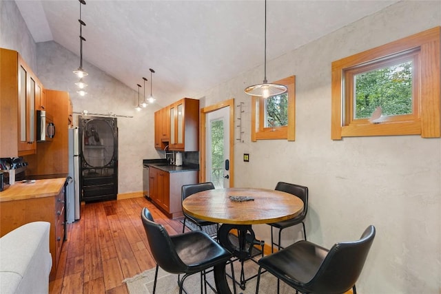 132 Azalea Ct, Sapphire, NC 28774 - dining space featuring vaulted ceiling and hardwood / wood-style flooring