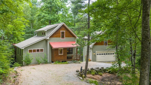 132 Azalea Ct, Sapphire, NC 28774 - chalet / cabin with a porch, gravel driveway, and a garage
