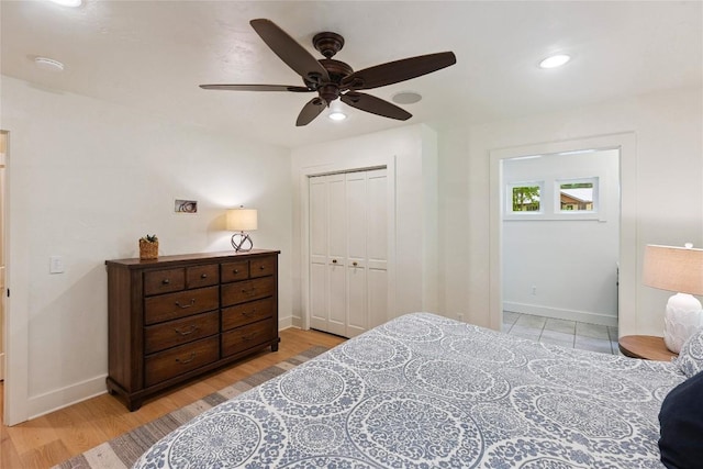 132 Azalea Ct, Sapphire, NC 28774 - bedroom with light wood-style floors, a closet, a ceiling fan, and recessed lighting