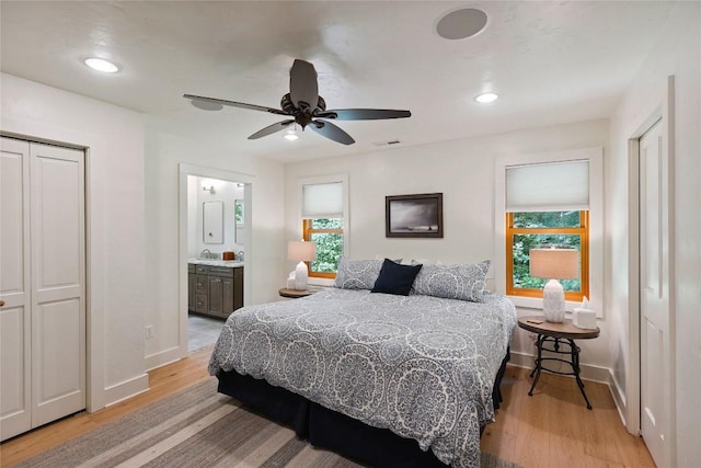 132 Azalea Ct, Sapphire, NC 28774 - bedroom featuring multiple windows, light wood-type flooring, ensuite bathroom, a ceiling fan, and recessed lighting