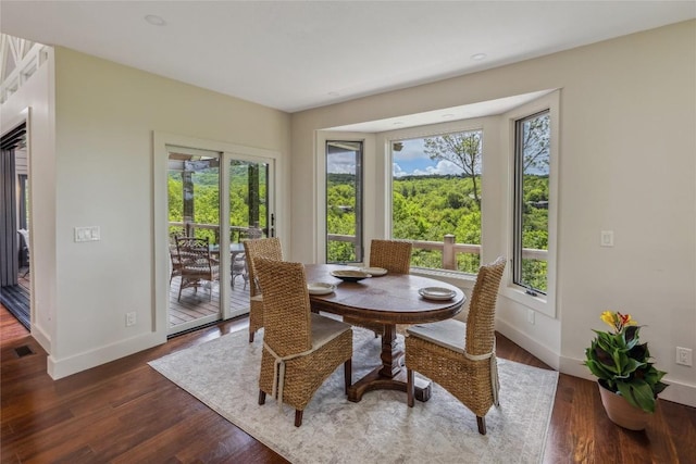 451 Country Club Dr, Highlands, NC 28741 - dining area with plenty of natural light and dark wood finished floors