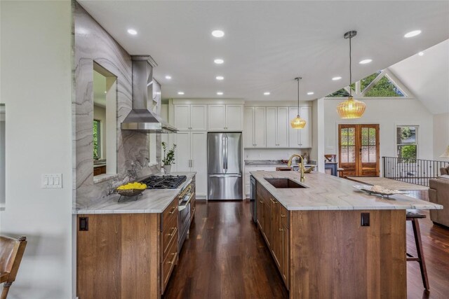 451 Country Club Dr, Highlands, NC 28741 - kitchen featuring stainless steel appliances, wall chimney exhaust hood, dark wood-style flooring, a kitchen breakfast bar, and white cabinets