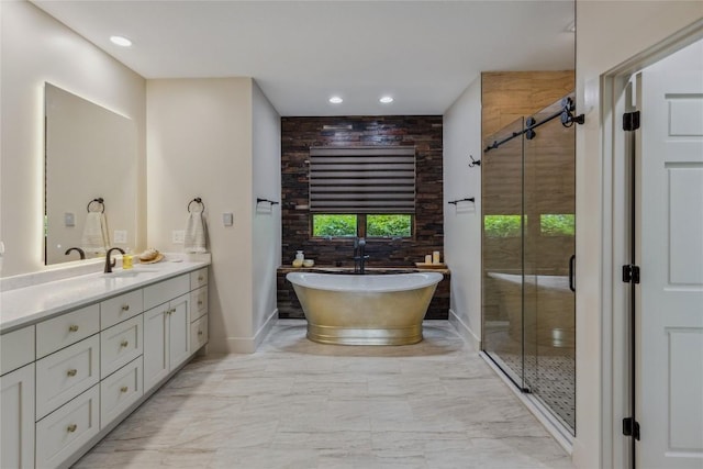 451 Country Club Dr, Highlands, NC 28741 - bathroom with vanity, a freestanding tub, marble finish flooring, a stall shower, and recessed lighting