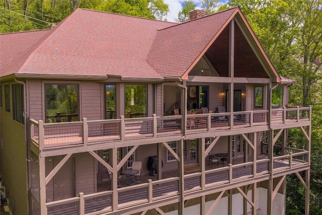 451 Country Club Dr, Highlands, NC 28741 - rear view of house with a chimney, a shingled roof, and a deck