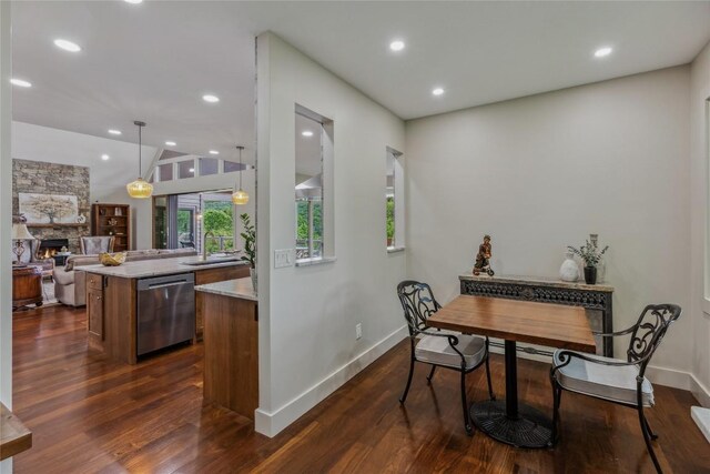 451 Country Club Dr, Highlands, NC 28741 - dining space featuring dark wood finished floors, a stone fireplace, vaulted ceiling, and recessed lighting