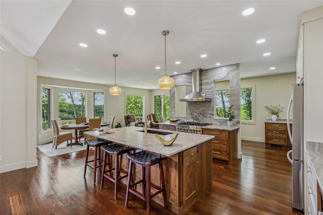 451 Country Club Dr, Highlands, NC 28741 - kitchen featuring wall chimney range hood, plenty of natural light, appliances with stainless steel finishes, and recessed lighting