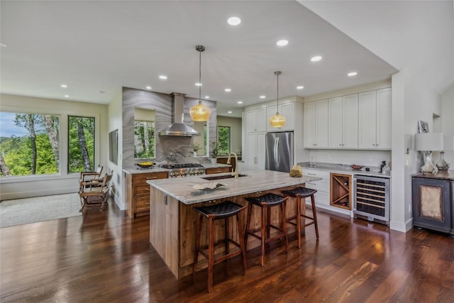 451 Country Club Dr, Highlands, NC 28741 - kitchen featuring beverage cooler, wall chimney exhaust hood, freestanding refrigerator, plenty of natural light, and recessed lighting