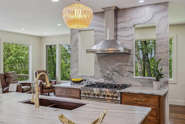 451 Country Club Dr, Highlands, NC 28741 - kitchen with wall chimney exhaust hood, high end stainless steel range, brown cabinetry, decorative backsplash, and recessed lighting