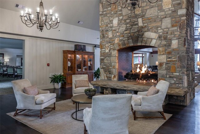 451 Country Club Dr, Highlands, NC 28741 - living room featuring a chandelier, arched walkways, wood finished floors, and a towering ceiling