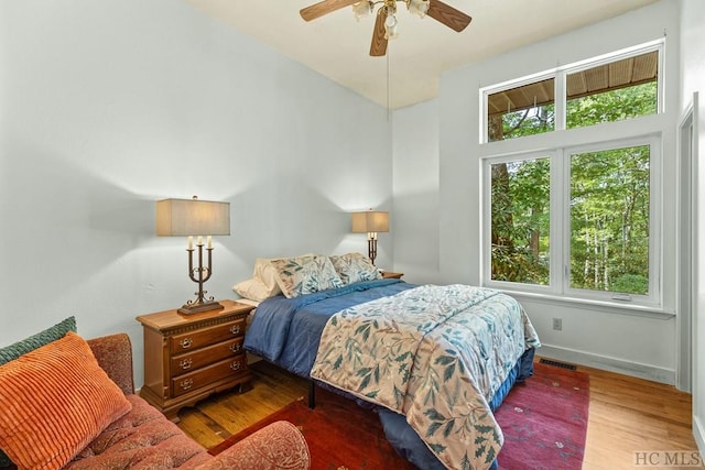 bedroom with hardwood / wood-style flooring and ceiling fan