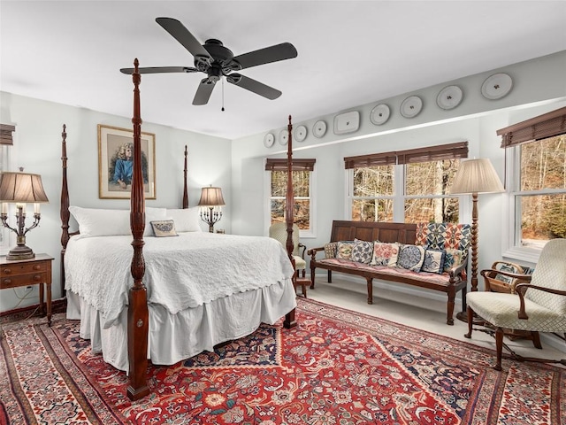 bedroom featuring ceiling fan and carpet