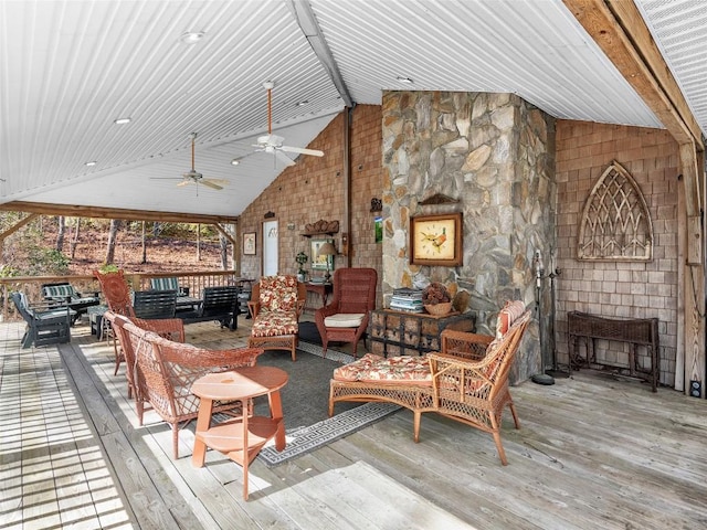 interior space with crown molding, a lit fireplace, baseboards, and wood finished floors