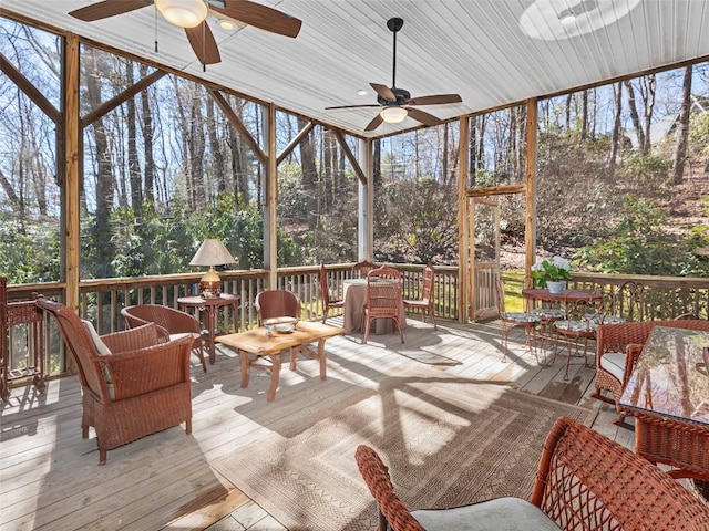 sunroom / solarium with ceiling fan and a healthy amount of sunlight