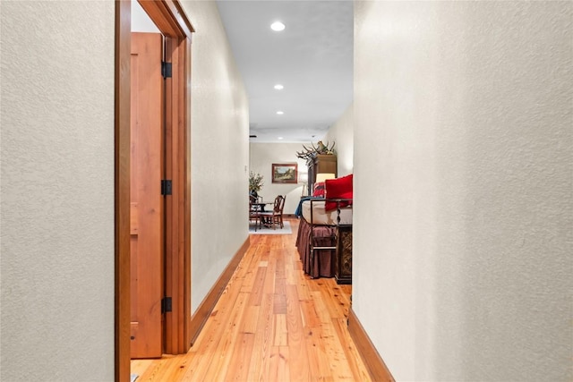 hallway featuring recessed lighting and light wood finished floors