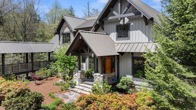 view of front of property featuring a standing seam roof, metal roof, and board and batten siding