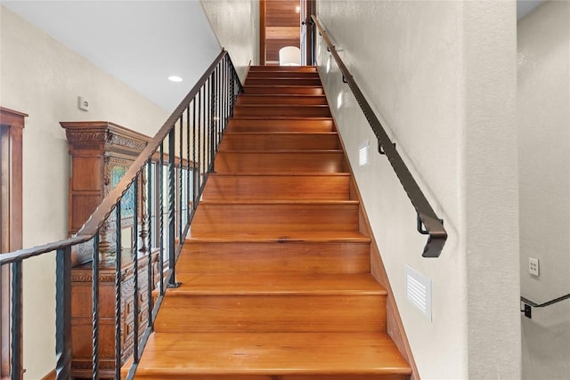 stairway with a towering ceiling