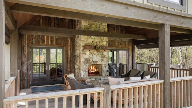 sunroom featuring french doors and lofted ceiling