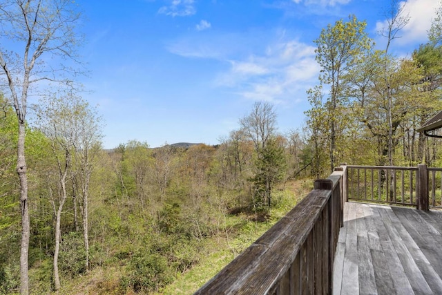 deck featuring a wooded view