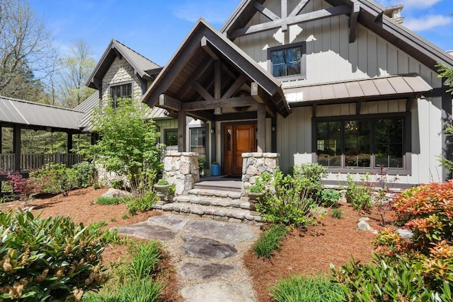 craftsman-style house with a standing seam roof, metal roof, and fence